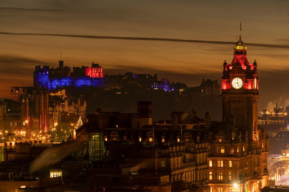 View of Edinburgh Castle and Balmoral Hotel at night