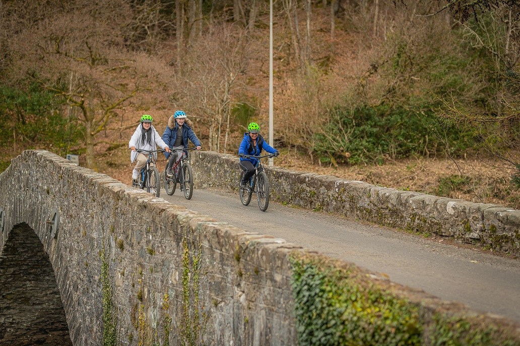 People cycling over the Bridge of Ross in Perthshire
