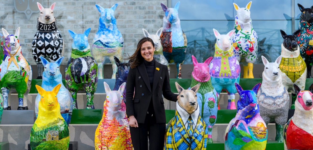 Mairi McAllan MSP celebrates the launch of the Royal Highland & Agricultural Society's "Flock to the Show" campaign.