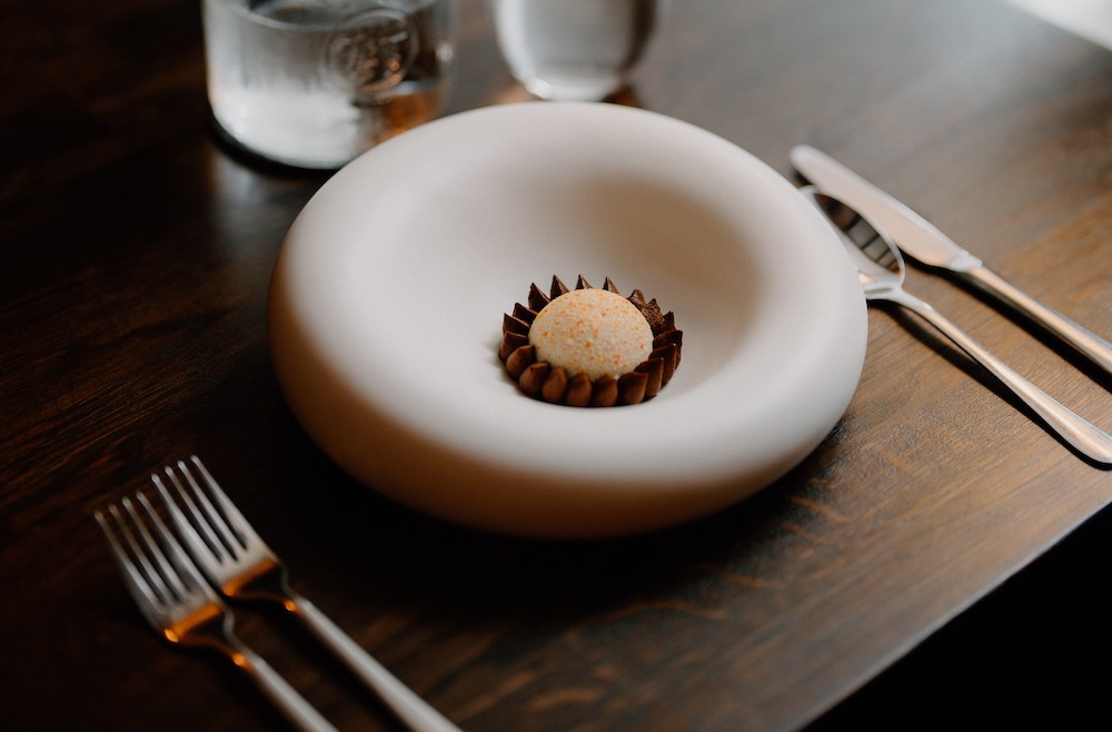 Dark chocolate with seabuckthorn in a round dish