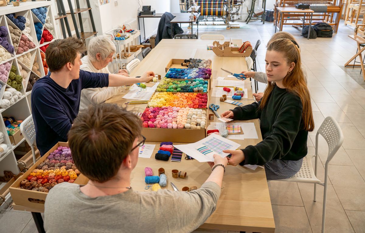 People weaving at Radical Weavers