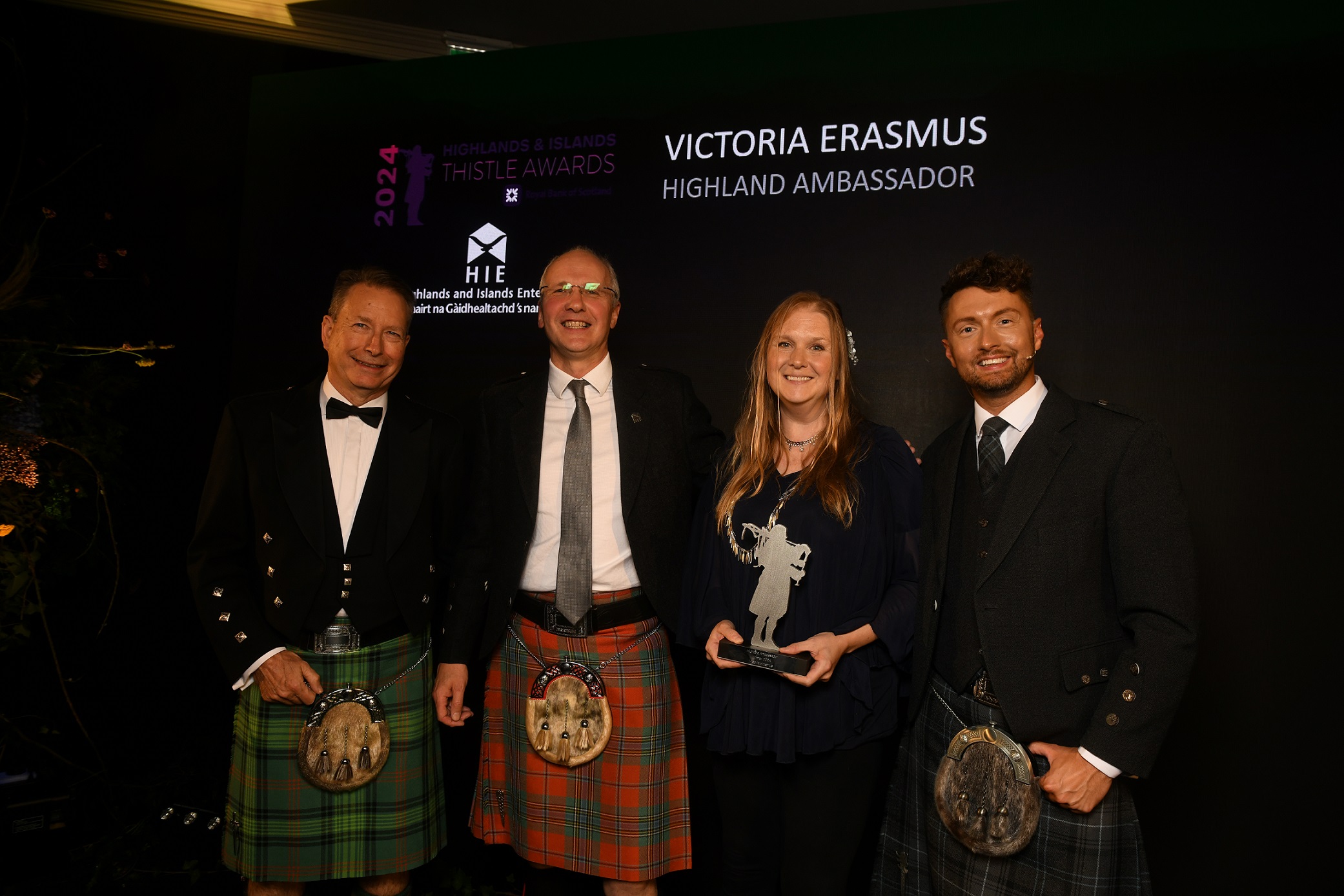 L-R: Calum Ross, Chair of HITA, Stuart Black, HIE, Highland Ambassador award winner Victoria Erasmus and host Sean Batty